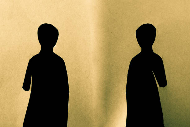istock Man shape cut out of paper in hand 1033357806