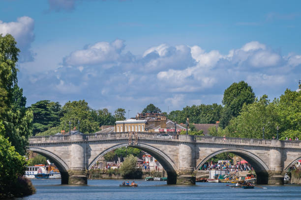 An iron and stone railway bridge in Richmond London, England -  July 2018 : An iron and stone railway bridge over the river Thames in Richmond 1908 stock pictures, royalty-free photos & images