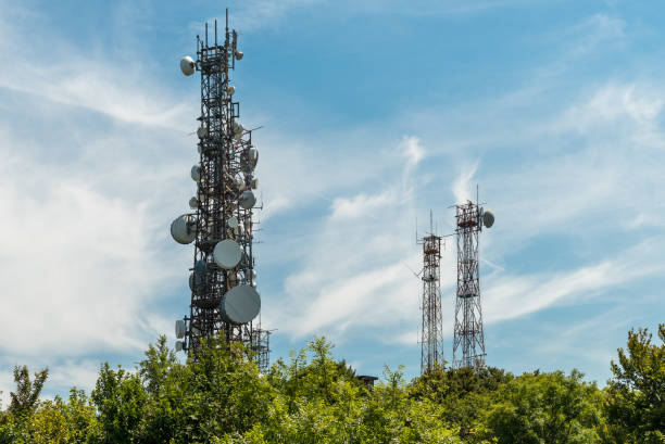 istock Iron Telecommunication tower with group of parabolic antennas. 1033366866
