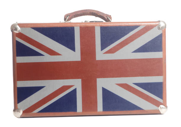 istock Vintage travel suitcase with British flag 1033367354