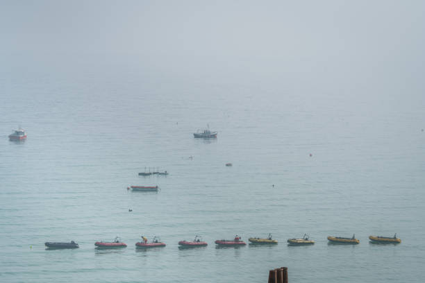 St. Ives, England -  May 2018 : Row of small motorboats in St Ives bay, Cornwall, UK, Europe