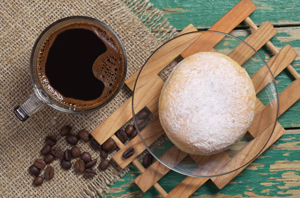 istock Coffee and donut in powdered sugar 1033375662