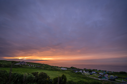 St. Ives, England -  May 2018 : Beautiful colorful sunset over the campground on the Cornish coast, Cornwall,  UK