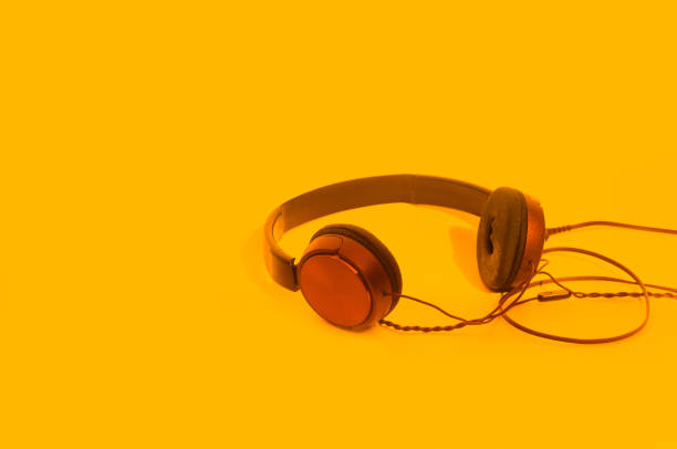 istock Headphones on orange 1033392222