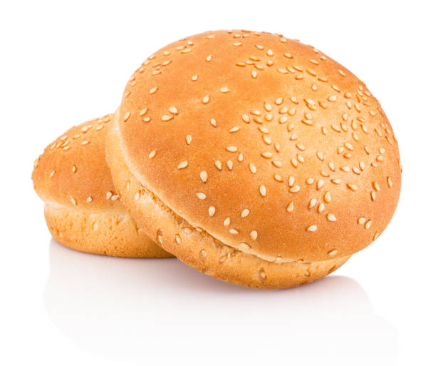 istock Two hamburger buns with sesame isolated on white background 1033412524