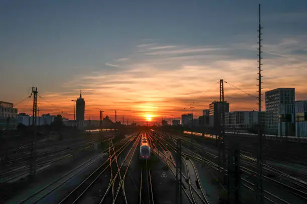 Photo of Sunset on the railroad and train station