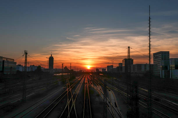 istock Sunset on the railroad and train station 1033421214