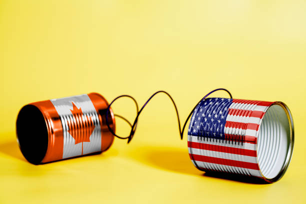 istock tin can phone with USA and Canada Flags. communication concept 1033426726
