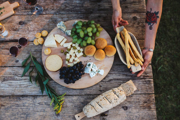 istock Home made cheese and various food on a rustic, wooden table 1033431496