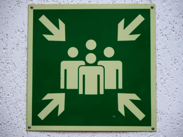 istock Sign on wall group of people and arrows 1033434522