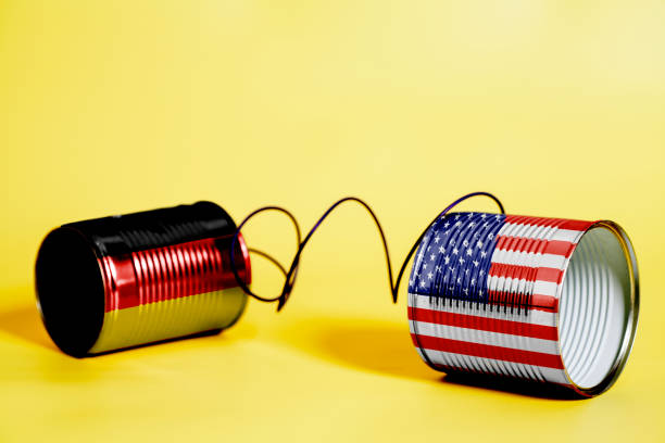 istock tin can phone with USA and German Flag. communication concept 1033441710