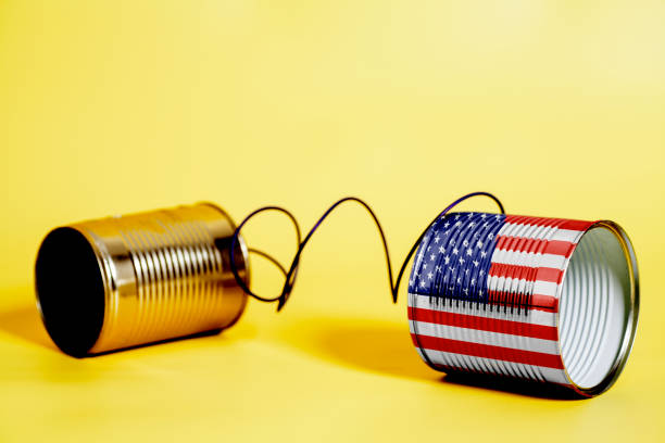 istock tin can phone with USA Flag. communication concept 1033442112