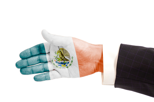 Handshake gesture businessman hand with Flag of Mexico isolated on white background