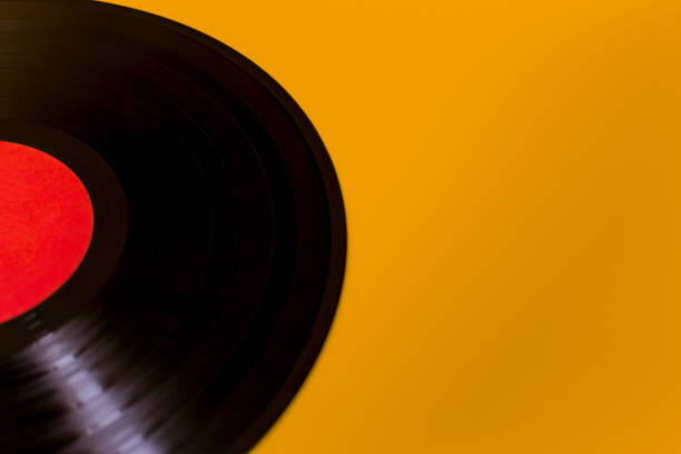istock vinyl black plate with red center on yellow background 1033474056