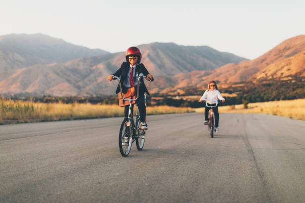 istock Young Business Boy Racing on Bicycle 1033483282