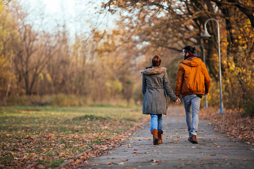 Romantic couple having a relaxing moments on their autumn walk
