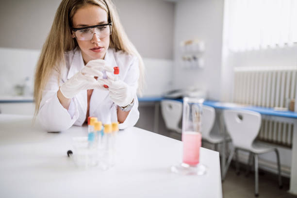 istock Lab Technician Examining Chemical Compound In Test Tube 1033511874