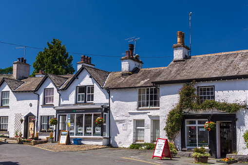 Hawkshead is a tiny village of charming houses, archways, and squares beloved by William Wordsworth and Beatrix Potter. With its narrow streets, cars are banned from the village located in the heart of the English Lake District.