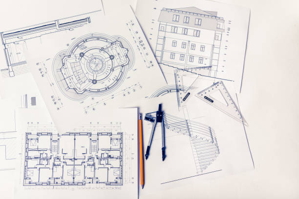 plantas em cima da mesa de arquitetos - drawing compass architect blueprint planning - fotografias e filmes do acervo