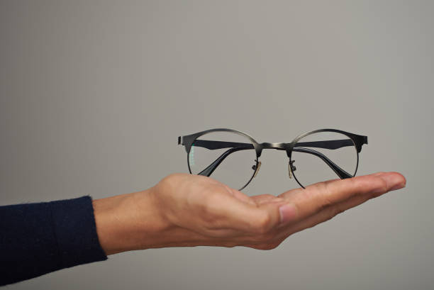 istock Holding glasses on hand palm 1033552822