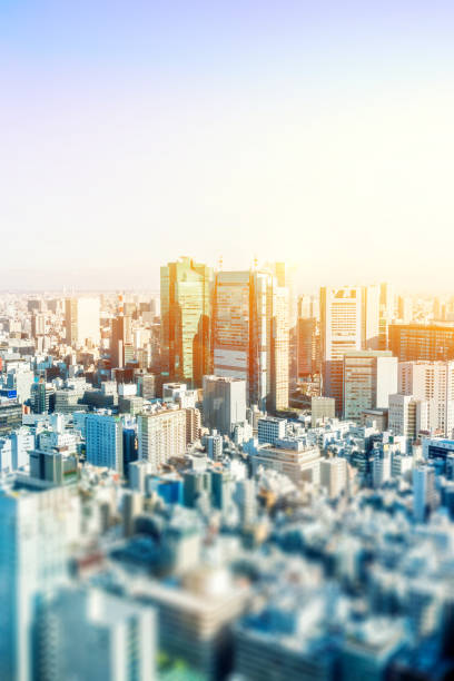 istock modern city skyline  in Tokyo, Japan with tilt shift effect 1033598646