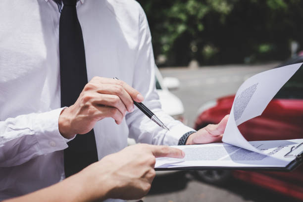 Traffic Accident and insurance concept, Insurance agent working on report form with car accident claim process Traffic Accident and insurance concept, Insurance agent working on report form with car accident claim process. car insurance photos stock pictures, royalty-free photos & images