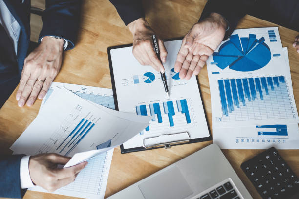 istock Executive team discussing the charts and graphs working in business strategy and financial plan to investment profit, discussing working analysis with financial data and marketing growth report 1033601034