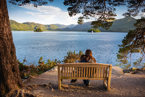 Keswick is a beautiful town located in the English Lake District, where the lush green hills meet the tranquil lake of Derwentwater. Shot in Summer during the late afternoon. Cat Bells Fell can be seen in the background.