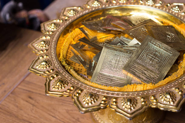 istock golden sheet on gold plate with buddha pattern 1033625328