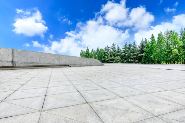istock Empty city square floor and green woods scenery 1033630748
