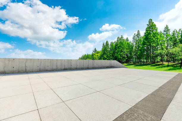 istock Empty city square floor and green woods scenery 1033632860