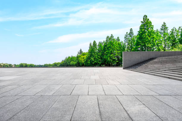 istock Empty city square floor and green woods scenery 1033632876
