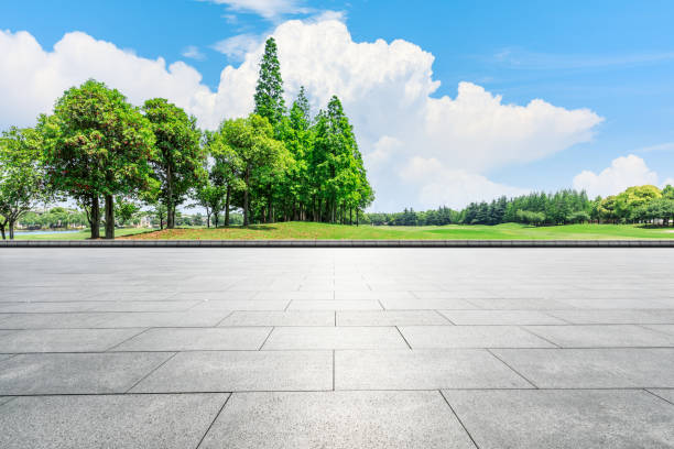 istock Empty city square floor and green woods scenery 1033633226