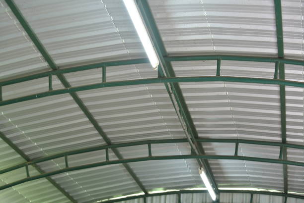 istock The factory roof from the inside has a bright light. 1033633556