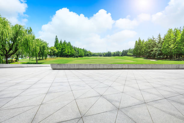 istock Empty city square floor and green woods scenery 1033638350