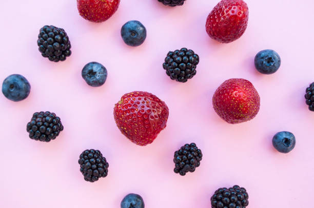 istock Flat lay of berries on pastel colored background. 1033638792