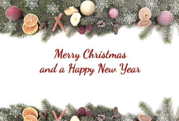 istock Christmas fir branches  with snow isolated against white background with the text Merry Christmas and a Happy New Year 1033651992