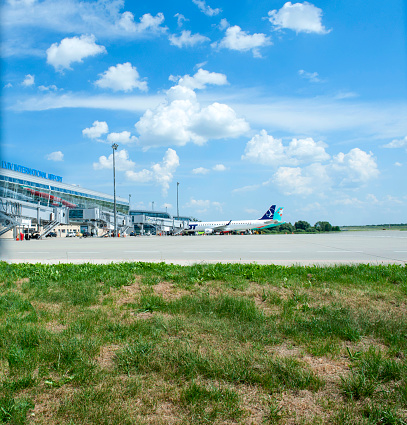 Lviv, Ukraine - July 19, 2017: Panoramic view of Danylo Halytskyi International airport. Danylo Halytskyi International Airport Lviv is the biggest airport in Western Ukraine according to passenger flow and destination network, it is situated 6 kilometers from the downtown to the south. According to the results of 2013 the destination network of the airport consists of 32 routes. The new air-terminal complex was built for the championship Euro-2012 and put into service on April 12, 2012
