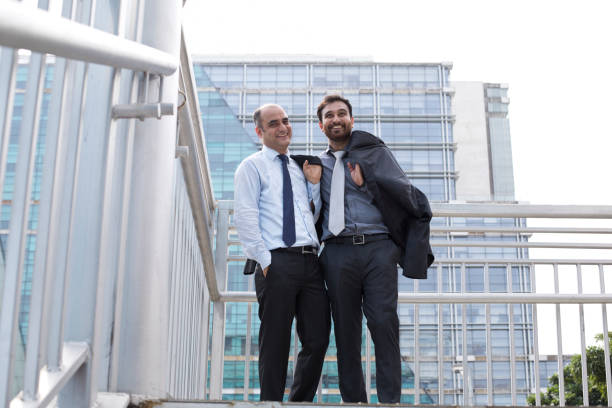 istock Two businessmen discussing in city 1033662308
