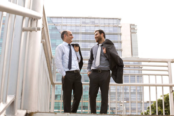 istock Two businessmen discussing in city 1033662426