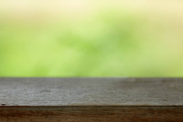 istock Wood table top on blur nature background 1033670068