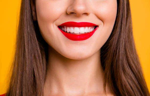 crop close up portrait half face of woman with beaming smile while being at the dentist - half smile imagens e fotografias de stock