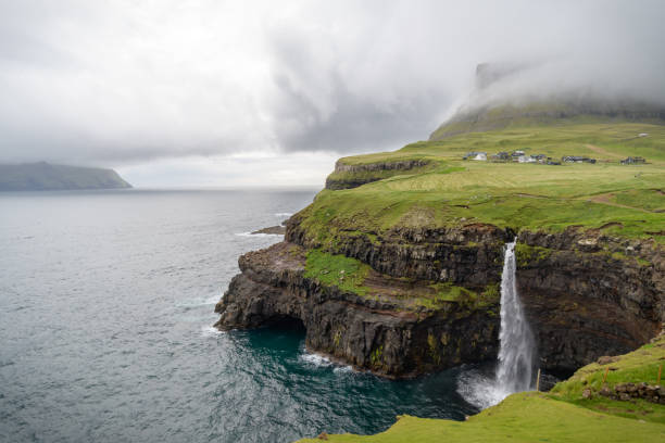 istock View of Mulafossur waterfall, Vagar Faroe Islands 1033694240