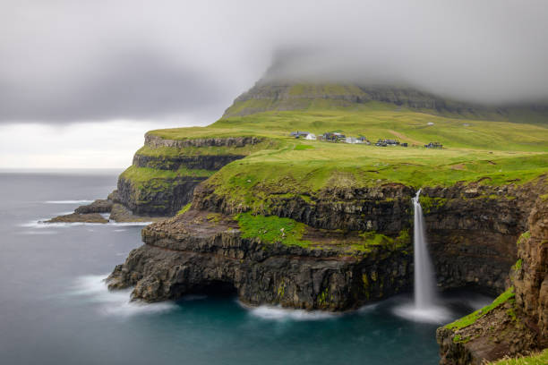 istock View of Mulafossur waterfall, Vagar Faroe Islands 1033694456