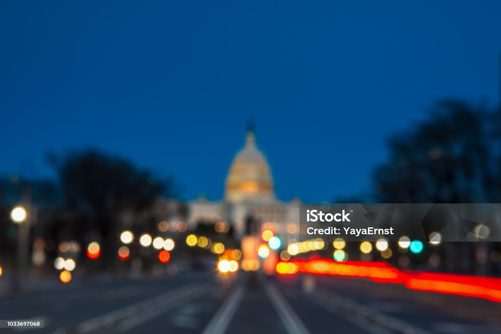 The United States Capitol with Blurred Background after sunset Washington DC Stock Photo