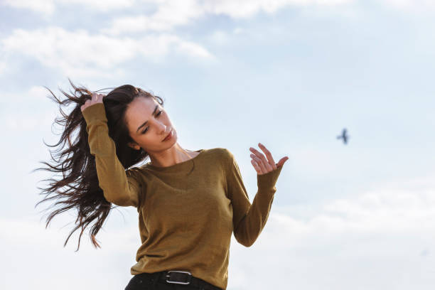 istock Beautiful Women On Windy Day 1033700540