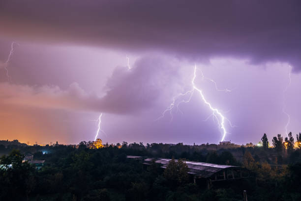 istock Lightning strikes during thunderstorm over the city 1033703958
