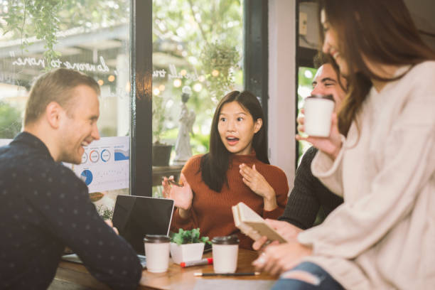 istock Group of friends chatting talking in cafe 1033704232