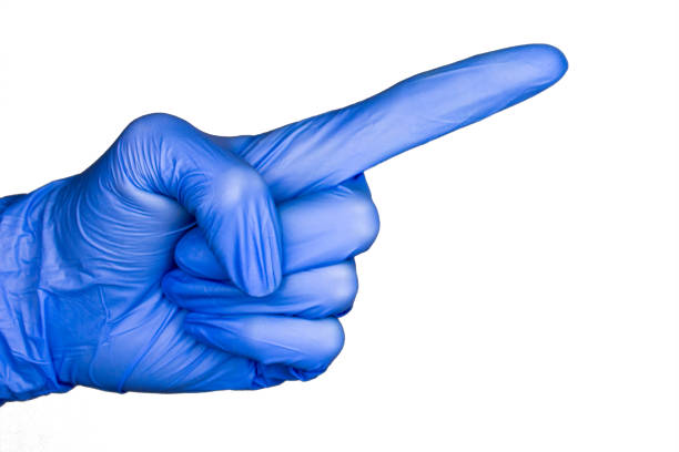 istock hand gesture in blue medical glove isolated 1033706824