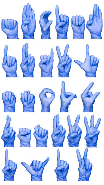 istock sign language alphabet hands in blue medical gloves isolated 1033706980